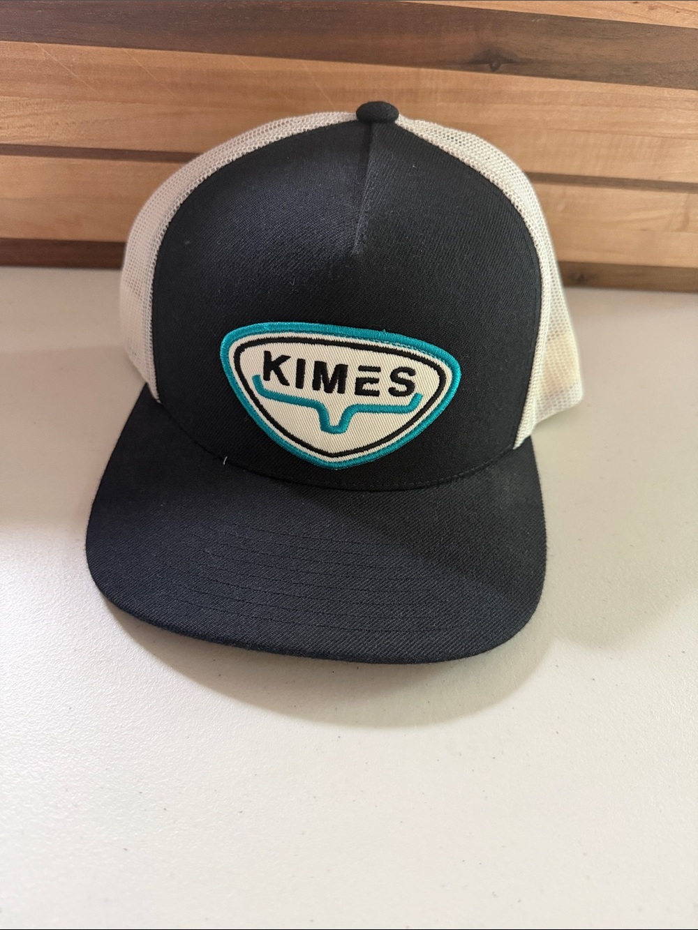 Kimes Ranch Black & White Trucker Hat with Teal Patch